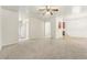 Spacious living room with neutral carpet, fireplace and ceiling fan at 6057 Hemperly Rd, Atlanta, GA 30349