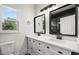 Modern bathroom with double vanity and white cabinets at 168 Milton St Sw Ave, Atlanta, GA 30314