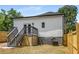 Back of house, featuring a deck and fenced yard at 168 Milton St Sw Ave, Atlanta, GA 30314