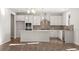 Modern kitchen with island, stainless steel appliances, and hardwood floors at 23 Rockberry Ct, Dallas, GA 30157