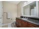 Bathroom boasts dark vanity, tile flooring and a large mirror at 325 E Paces Ferry Rd # 1110, Atlanta, GA 30305