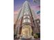 Stunning exterior view of the high-rise building with brick facade and glass entryway at 325 E Paces Ferry Rd # 1110, Atlanta, GA 30305