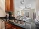 Modern kitchen with granite countertops, stainless steel appliances, and breakfast bar at 325 E Paces Ferry Rd # 1110, Atlanta, GA 30305