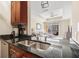 Modern kitchen with granite countertops and stainless steel appliances at 325 E Paces Ferry Rd # 1110, Atlanta, GA 30305