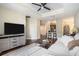 Open living space with hardwood floors, sectional sofa, and kitchen views at 325 E Paces Ferry Rd # 1110, Atlanta, GA 30305