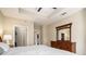 Main bedroom with king bed and large dresser with a mirror at 325 E Paces Ferry Rd # 1110, Atlanta, GA 30305