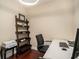 Home office with hardwood floors, desk, and shelving at 325 E Paces Ferry Rd # 1110, Atlanta, GA 30305