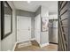 Bright entryway with wood-look floors, a white door, and a view of the kitchen at 325 E Paces Ferry Ne Rd # Apt 710, Atlanta, GA 30305