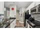 Modern kitchen with stainless steel appliances and granite countertops at 325 E Paces Ferry Ne Rd # Apt 710, Atlanta, GA 30305