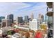 Stunning aerial view of cityscape, offering breathtaking city skyline and treetop perspectives at 943 Peachtree Ne St # 1708, Atlanta, GA 30309