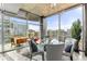 Modern dining area with glass table and stunning city views at 943 Peachtree Ne St # 1708, Atlanta, GA 30309