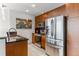 Modern kitchen, stainless steel appliances, wood cabinets at 943 Peachtree Ne St # 1708, Atlanta, GA 30309