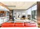 Spacious living room with floor to ceiling windows, city views, and modern furniture at 943 Peachtree Ne St # 1708, Atlanta, GA 30309