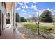 Spacious front porch with brick flooring and white columns at 9465 River Lake Dr, Roswell, GA 30075