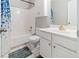 Bathroom with shower/tub combo, white vanity, and updated fixtures at 1968 Drennon Ave, Austell, GA 30106