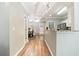 Hallway with wood-look flooring leading to kitchen and dining areas at 1968 Drennon Ave, Austell, GA 30106