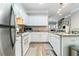 White kitchen with granite countertops and stainless steel appliances at 1968 Drennon Ave, Austell, GA 30106
