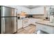 White kitchen with granite countertops and stainless steel appliances at 1968 Drennon Ave, Austell, GA 30106