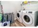 Laundry room with washer, dryer, and storage shelving at 1968 Drennon Ave, Austell, GA 30106