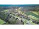 Aerial view of a residential neighborhood with houses and a golf course at 198 Grandmar Chase, Canton, GA 30115