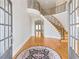 Grand entry with curved staircase and hardwood floors at 198 Grandmar Chase, Canton, GA 30115