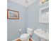 Small powder room with pedestal sink and light blue walls at 3275 Lenox Ne Rd # 206, Atlanta, GA 30324