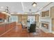 Community room with fireplace, dining area, and kitchen at 3275 Lenox Ne Rd # 206, Atlanta, GA 30324