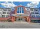 Brick building exterior with large windows and landscaping at 3275 Lenox Ne Rd # 206, Atlanta, GA 30324