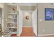 Bright hallway with built-in shelves and hardwood floors at 3275 Lenox Ne Rd # 206, Atlanta, GA 30324