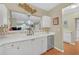 White kitchen with stainless steel appliances and mosaic backsplash at 3275 Lenox Ne Rd # 206, Atlanta, GA 30324