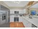 Modern white kitchen with stainless steel appliances at 3275 Lenox Ne Rd # 206, Atlanta, GA 30324