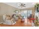Living room with hardwood floors, balcony access, and fireplace at 3275 Lenox Ne Rd # 206, Atlanta, GA 30324