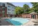 Inviting community pool with surrounding lounge chairs at 3275 Lenox Ne Rd # 206, Atlanta, GA 30324