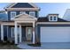 Two-story home with a light yellow front door and brick accents at 4078 Annsbury Ct, Lilburn, GA 30047