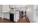 Modern kitchen with white cabinets, granite countertops, and black appliances at 5076 Longview Walk, Decatur, GA 30035