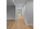 Bright hallway with light grey walls and hardwood floors at 2520 Peachtree Nw Rd # 403, Atlanta, GA 30305