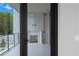 Glass door opens to a private balcony with fireplace and outdoor space at 2520 Peachtree Nw Rd # 403, Atlanta, GA 30305