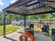 Relaxing backyard with gazebo, fire pit, and above ground pool at 10 Toscanno Dr, Covington, GA 30014