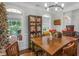 Bright dining room featuring a wooden table and large windows at 10 Toscanno Dr, Covington, GA 30014