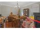 Simple dining room with wooden table and a chandelier at 10 Toscanno Dr, Covington, GA 30014