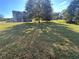 Large grassy backyard with a house in the background at 230 Farm St, Hiram, GA 30141