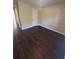 Simple bedroom with dark hardwood floors and a closet at 230 Farm St, Hiram, GA 30141