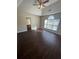 Bright bedroom featuring dark hardwood floors and an arched window at 230 Farm St, Hiram, GA 30141