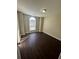 Bedroom with dark hardwood floors and an arched window at 230 Farm St, Hiram, GA 30141