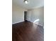 Bedroom with dark hardwood floors and access to bathroom at 230 Farm St, Hiram, GA 30141