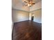 Spacious bedroom with dark hardwood floors and ceiling fan at 230 Farm St, Hiram, GA 30141