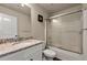 Bathroom with granite countertop, white vanity, and shower/tub combo at 2570 Reynolds Sw Rd, Atlanta, GA 30331