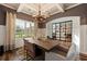 Formal dining room with wood floors, chandelier, and a view into the adjacent living area at 2570 Reynolds Sw Rd, Atlanta, GA 30331