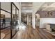 Bright entryway with hardwood floors, glass doors, and a staircase to the second floor at 2570 Reynolds Sw Rd, Atlanta, GA 30331