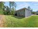 Two-story house with gray siding, screened porch, and grassy yard at 2570 Reynolds Sw Rd, Atlanta, GA 30331